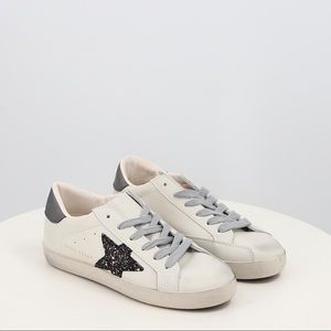 Distressed Sneaker with crystal star detailing in white faux leather and purple